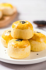 Chinese dessert egg yolk puff on table