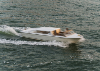 Fototapeta premium blurred photo of a boat navigating in the ocean 