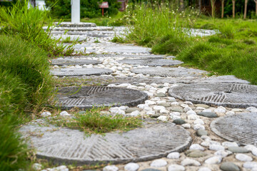 Landscape decorated with traditional stone mill in Chinese garden