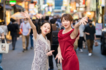 Two women posing in downtown