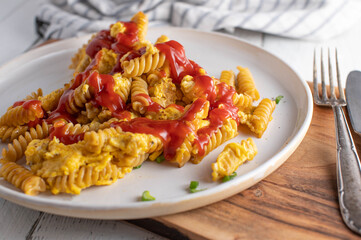Pasta with eggs and ketchup