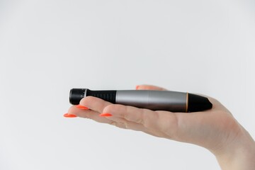 Manipulas for hardware procedures. Electric pen for derma stamp. Dermapen. Needle mesotherapy procedure. Professional skin care in the salon, medical procedure.  Acne treatment.