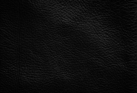 Closeup of seamless black leather texture background, surface material for fashion dark pattern luxury wallet components with fabric exclusive.