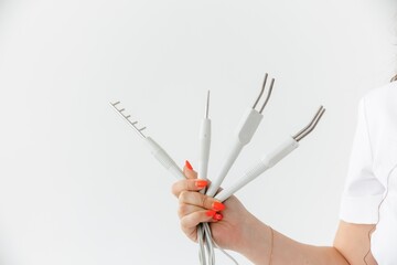 Manipulas for hardware procedures in the hands of a beautician. on white background. electric...