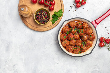 Traditional spicy meatballs in sweet and sour tomato sauce. Restaurant menu, dieting, cookbook recipe top view