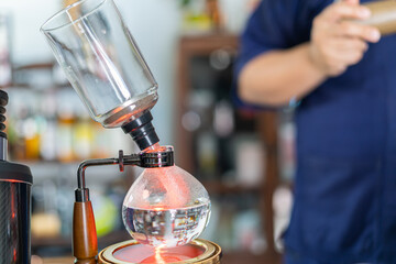 Making coffee with syphon method