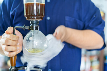 Making coffee with syphon method