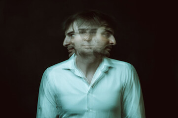 schizophrenic abstract blurry portrait of man with mental disorders and mental illnesses on dark...