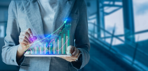 Double exposure of businessman using digital tablet with stock market graph or forex trading chart, Business and financial concept.