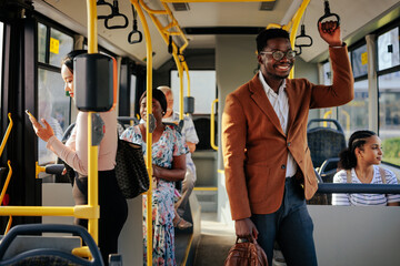 Young black businessman on public bus