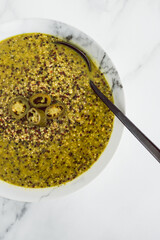 healthy plant-based food, vegan pesto quinoa with spicy jalapeno peppers