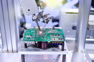 High technology and modern automatic robot for print circuit board (PCB)assembly machine during soldering or welding part or component at factory