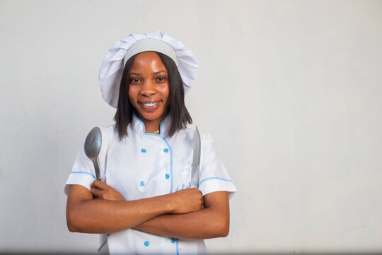 Portrait of a cheerful young woman cook
