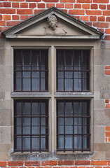 Fototapeta na wymiar Barred window from a renaissance building or castle prison.