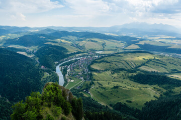 View from the popular peak in Pieniny (Three Crowns, Tri Koruny, Trzy Korony). In the valley you can see the villages where the popular tourist attraction on the Dunajec River begins - Timber rafting. © gubernat