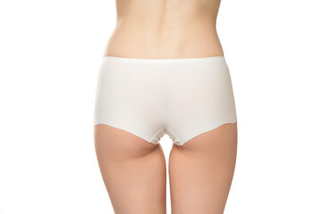 Mid section of woman wearing white briefs,  back view on a white background - Powered by Adobe