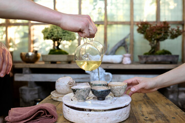 Traditional tea ceremony outdoor in a garden gazebo