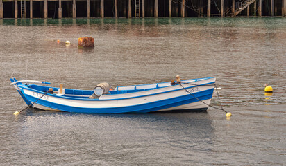 Dinghy in harbour.