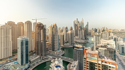 Fototapeta premium Panorama showing various skyscrapers in tallest recidential block in Dubai Marina aerial timelapse