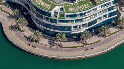 Dubai Marina waterfront and city promenade timelapse from above.