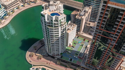 Dubai Marina waterfront and city promenade timelapse from above. - obrazy, fototapety, plakaty