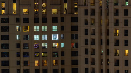 Evening view of exterior apartment recidential building timelapse with glowing windows