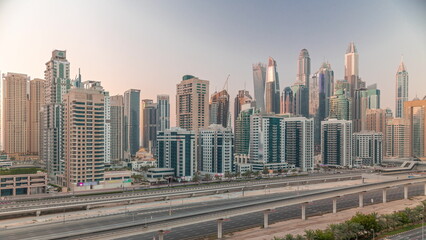 Fototapeta na wymiar Dubai marina tallest block of skyscrapers timelapse.