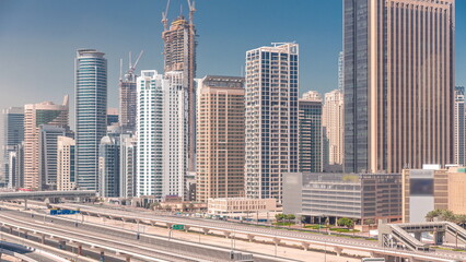 Fototapeta na wymiar Dubai Marina skyscrapers and Sheikh Zayed road with metro railway aerial timelapse, United Arab Emirates