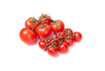 Fresh red cherry tomato clusters of different size isolated on white