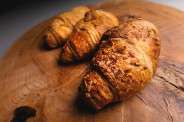 Close up of a bunch of delicious croissants on a dark background. Homemade croissants.