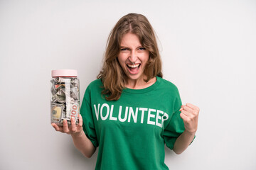 young girl with a donation banknotes bottle. volunteer concept