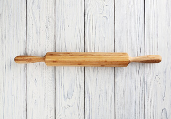 Rolling pin on white wooden table