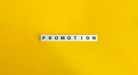 Promotion Word on Letter Tiles on Yellow Background. Minimal Aesthetics.
