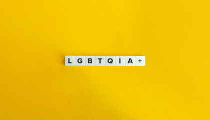 LGBTQIA+ Inclusive Term on Letter Tiles on Yellow Background. Minimal Aesthetics.