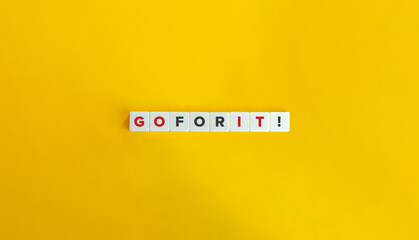 Go For It Phrase on Letter Tiles on Yellow Background. Minimal Aesthetics.