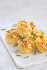 Delicious egg muffins with ham, cheese and vegetables