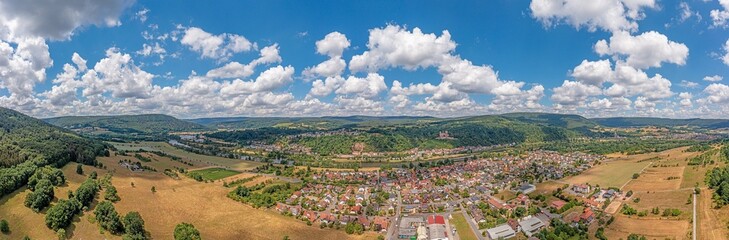Fototapeta na wymiar Drone panorama over river Main in Germany with village Stadtprozelten during daytime