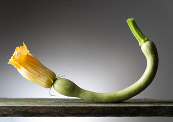 Courgette wit flower on the wooden table