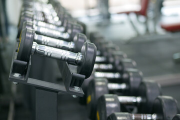 Obraz premium Dumbbell, barbell in the gym with copy space .