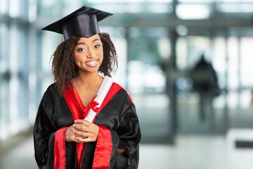 Young woman graduate student with diploma