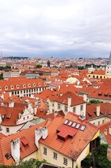 Naklejka na ściany i meble Prague, Czech Republic. Mala Strana, Lesser Town of Prague. Top view , downtown, panorama. Ancient old buildings with red tiled roofs, church, tower, castle