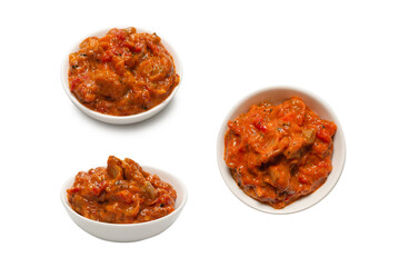Vegetable stew in a bowl isolated on white background.