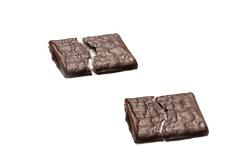 Dark chocolate candies isolated on white background.