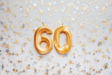 Number 60 sixty golden celebration birthday candle on Festive Background. sixty years birthday....