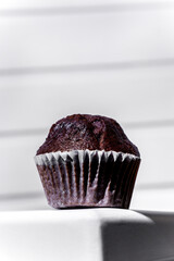 Chocolate cupcake in paper wrapper