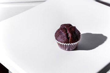 Chocolate cupcake in paper wrapper