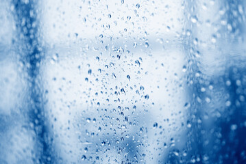 Fototapeta na wymiar water drop glass background , nature water drop after rain , raindrops on glass window in the rainy season