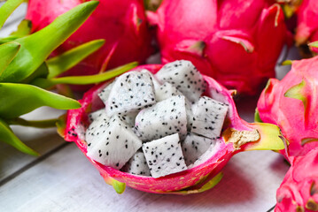 dragon fruit slice on fruit peel with pitahaya background , fresh white dragon fruit tropical in...
