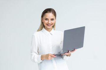 Happy woman using laptop in casual attire isolated in white background