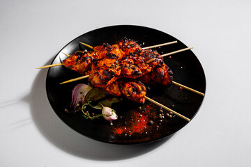 Fried chicken meat on skewers